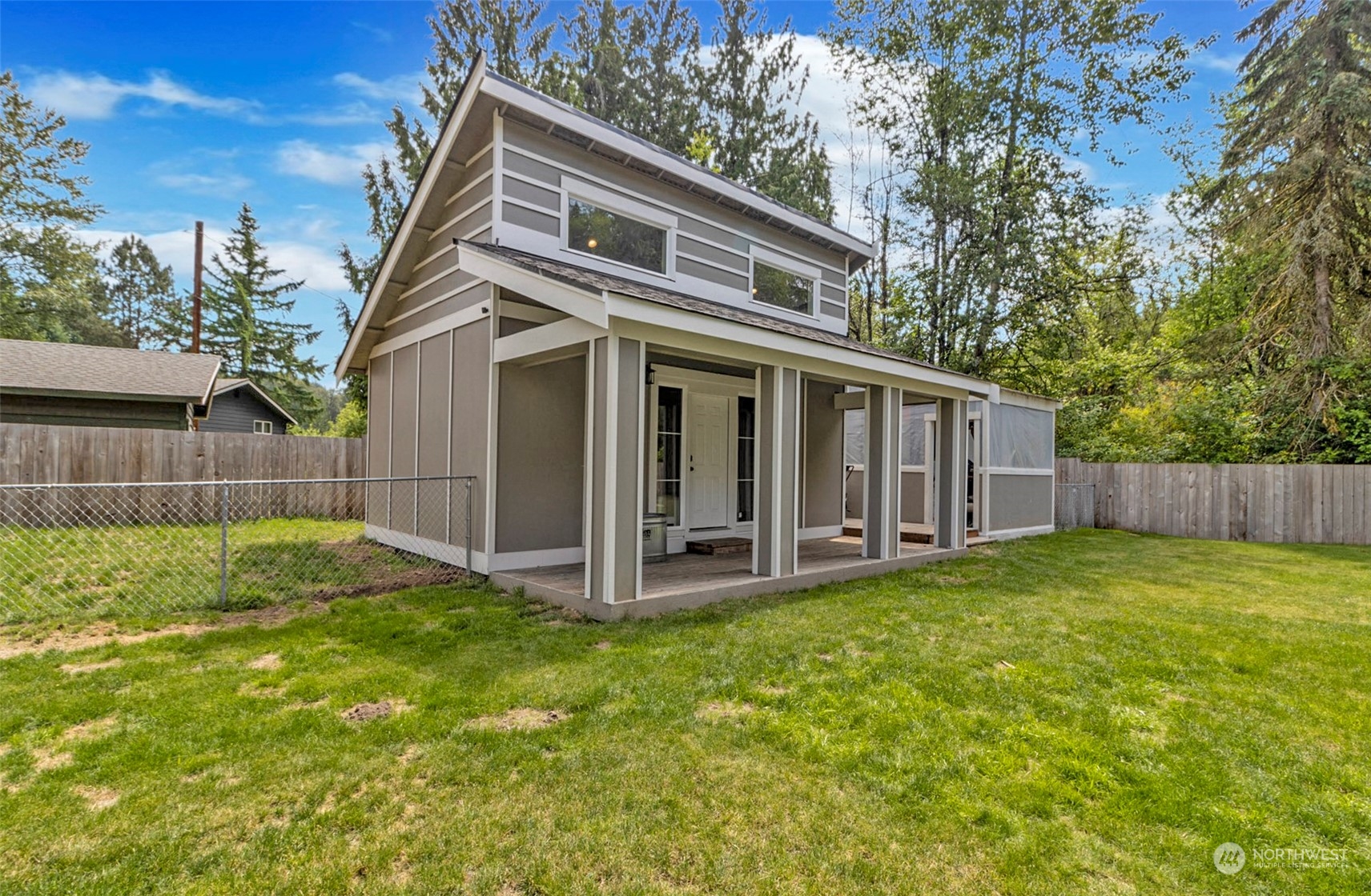 5124 Schwarzmiller Road Lake Stevens, WA 98258 - Photo 26 of 32 a view of a house with a yard and wooden fence