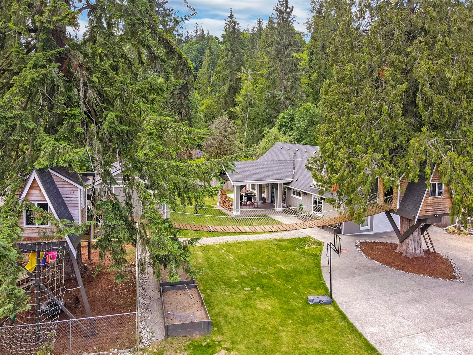 5124 Schwarzmiller Road Lake Stevens, WA 98258 - Photo 29 of 32 an aerial view of a house with swimming pool and porch