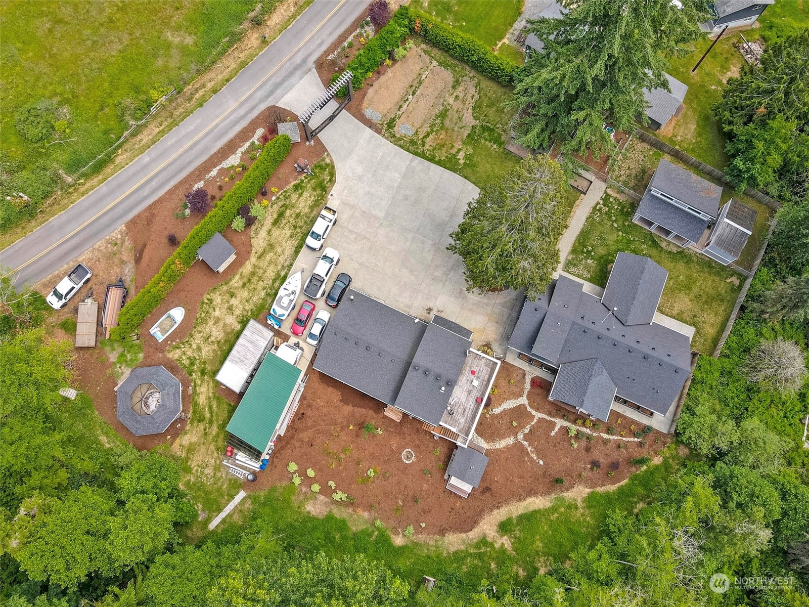 5124 Schwarzmiller Road Lake Stevens, WA 98258 - Photo 31 of 32 an aerial view of a house with garden space and street view