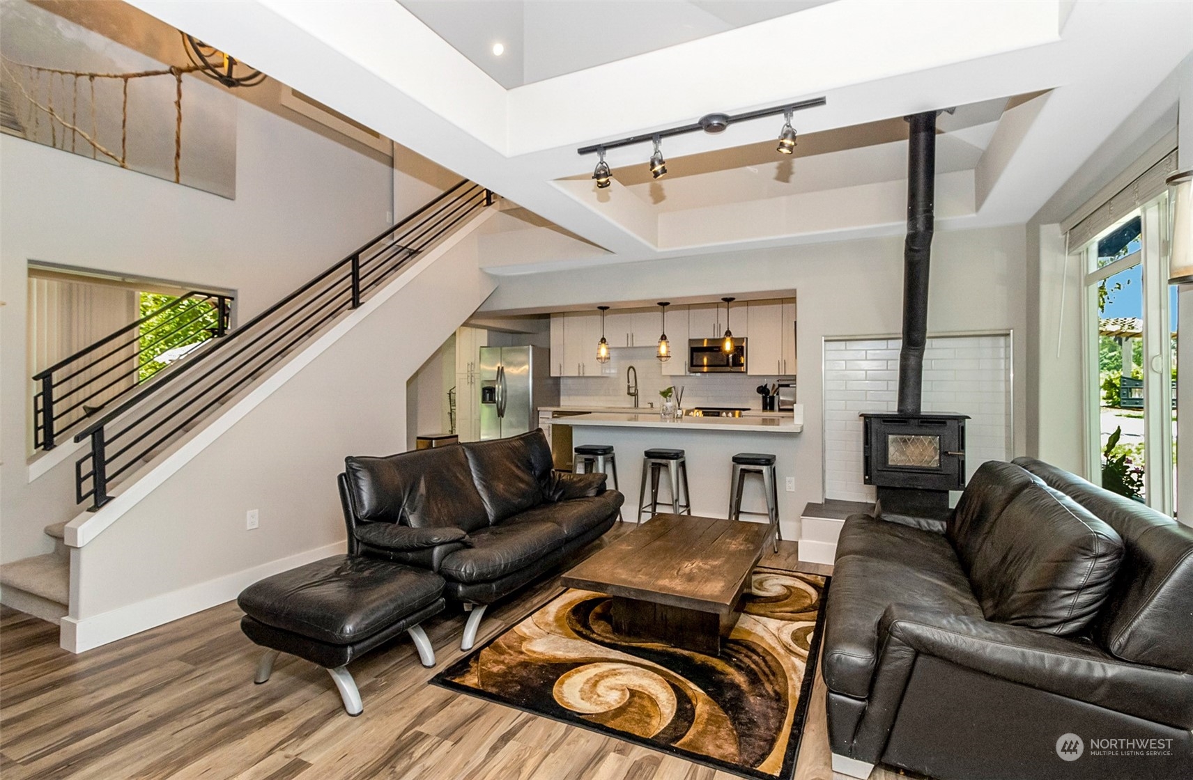 5124 Schwarzmiller Road Lake Stevens, WA 98258 - Photo 8 of 32 a living room with furniture a flat screen tv and a fireplace