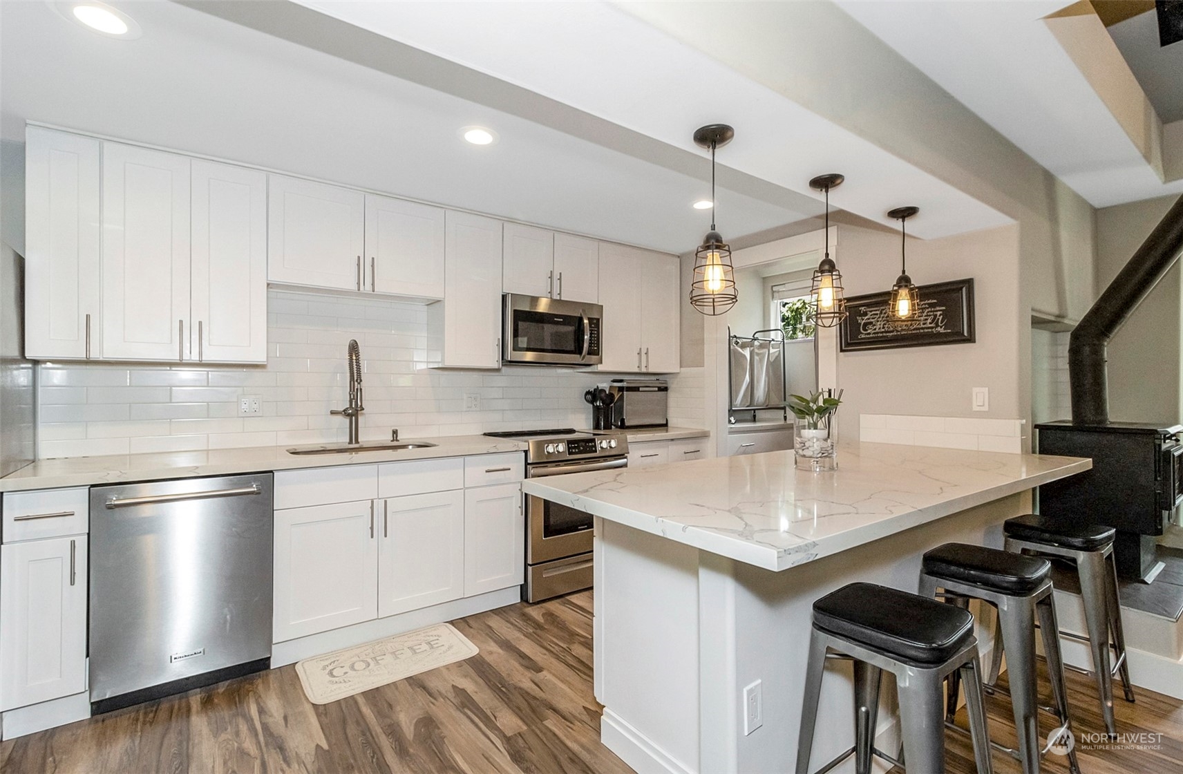 5124 Schwarzmiller Road Lake Stevens, WA 98258 - Photo 9 of 32 a kitchen with a sink stainless steel appliances and white cabinets