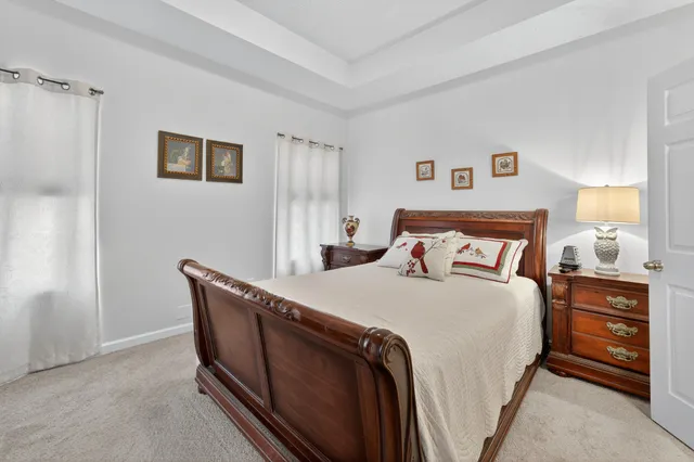 a bedroom with bed and cabinet