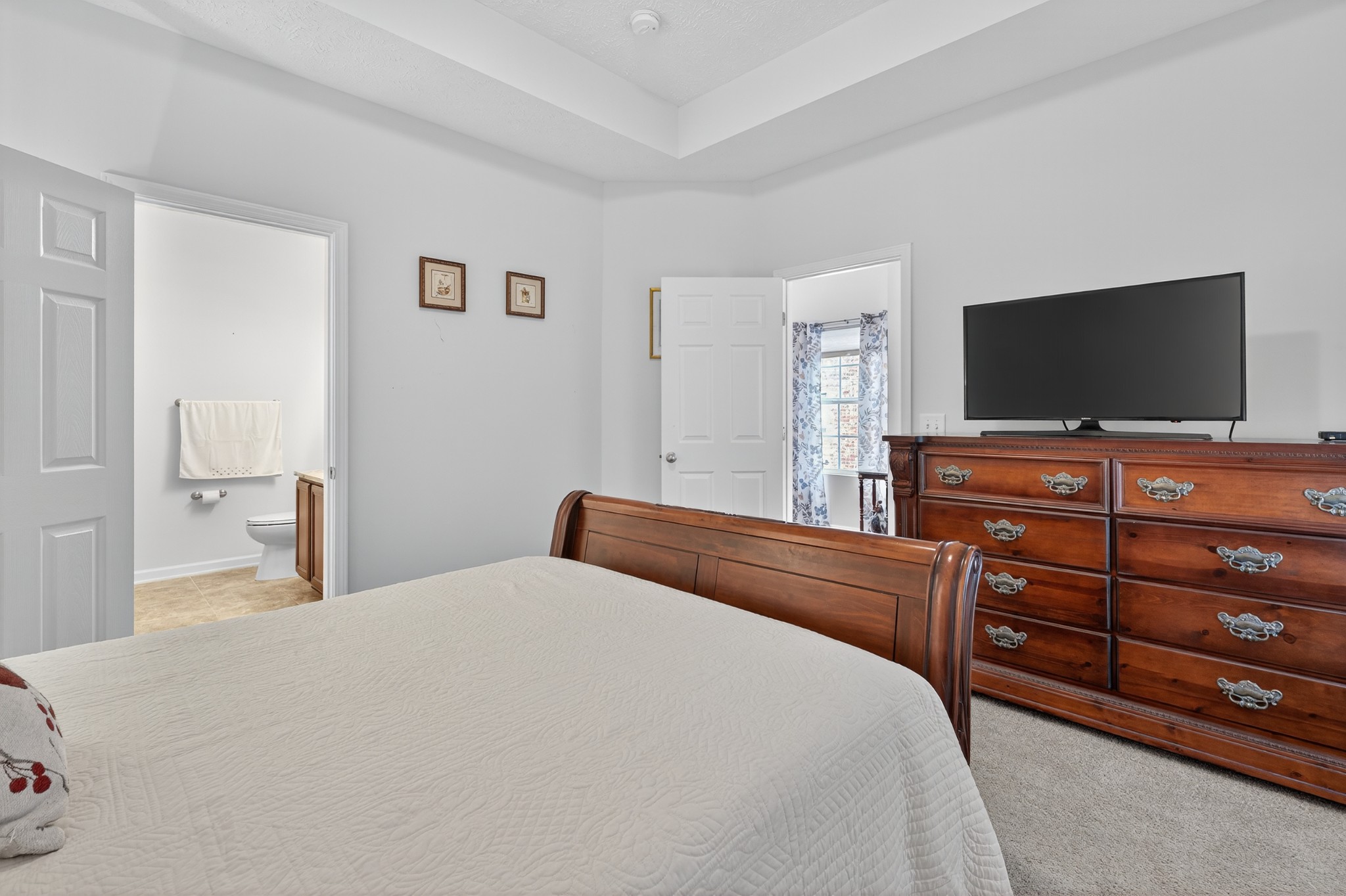 1309 Crown Point Place Nashville, TN 37211 - Photo 19 of 42 a bedroom with a bed and a flat screen tv