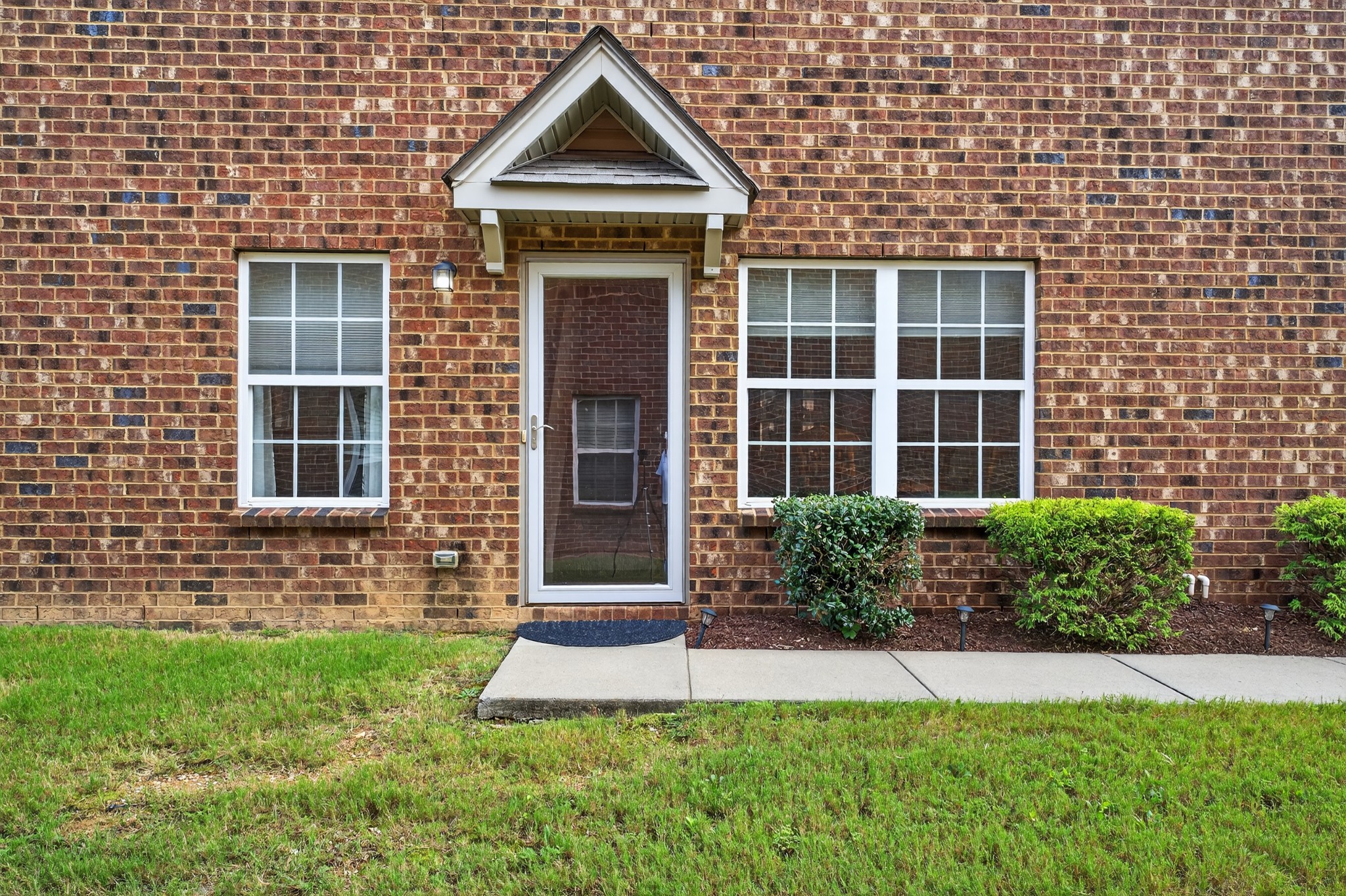 1309 Crown Point Place Nashville, TN 37211 - Photo 2 of 42 a front view of a house with a yard