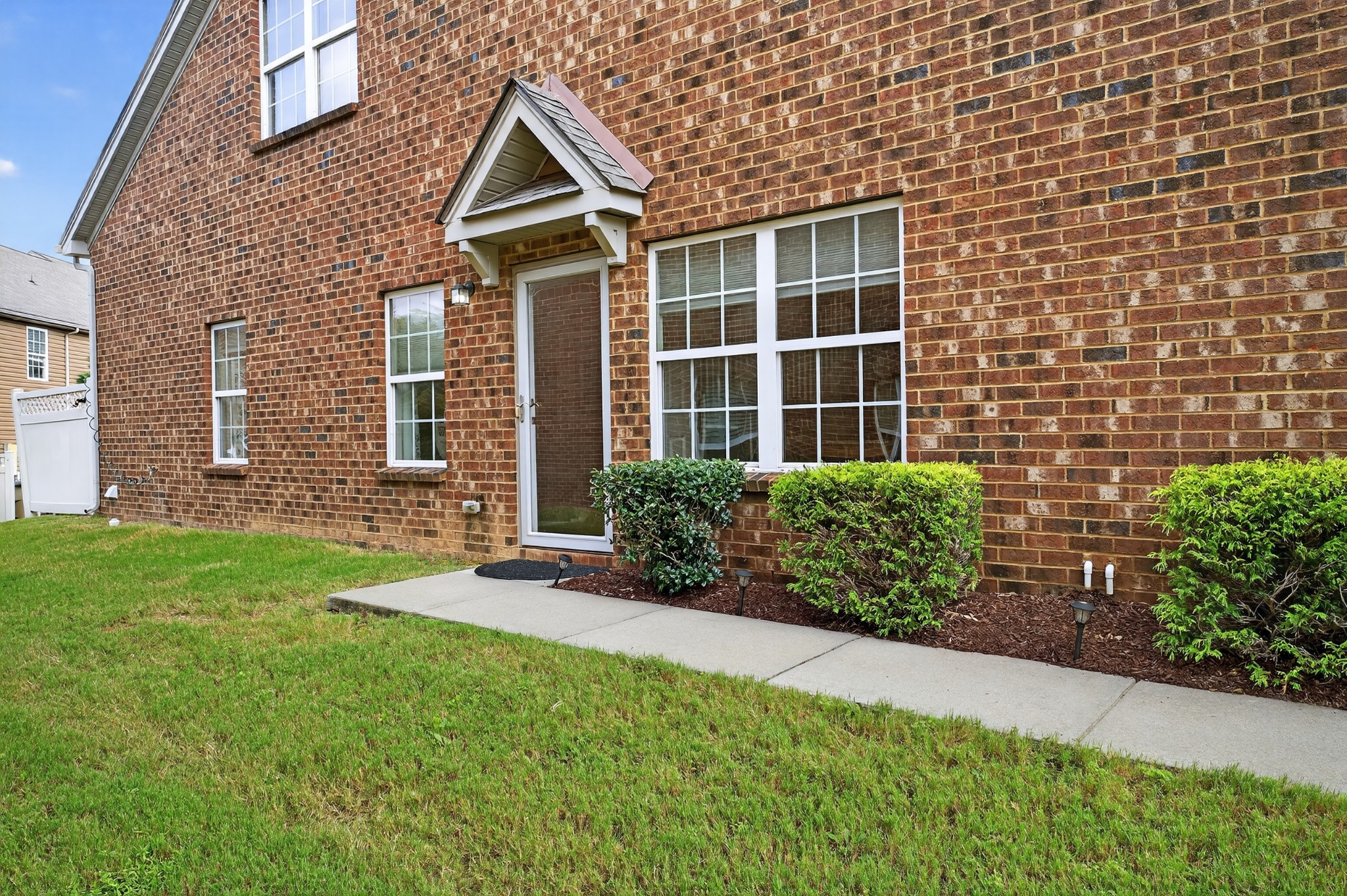 1309 Crown Point Place Nashville, TN 37211 - Photo 3 of 42 a front view of a house with garden