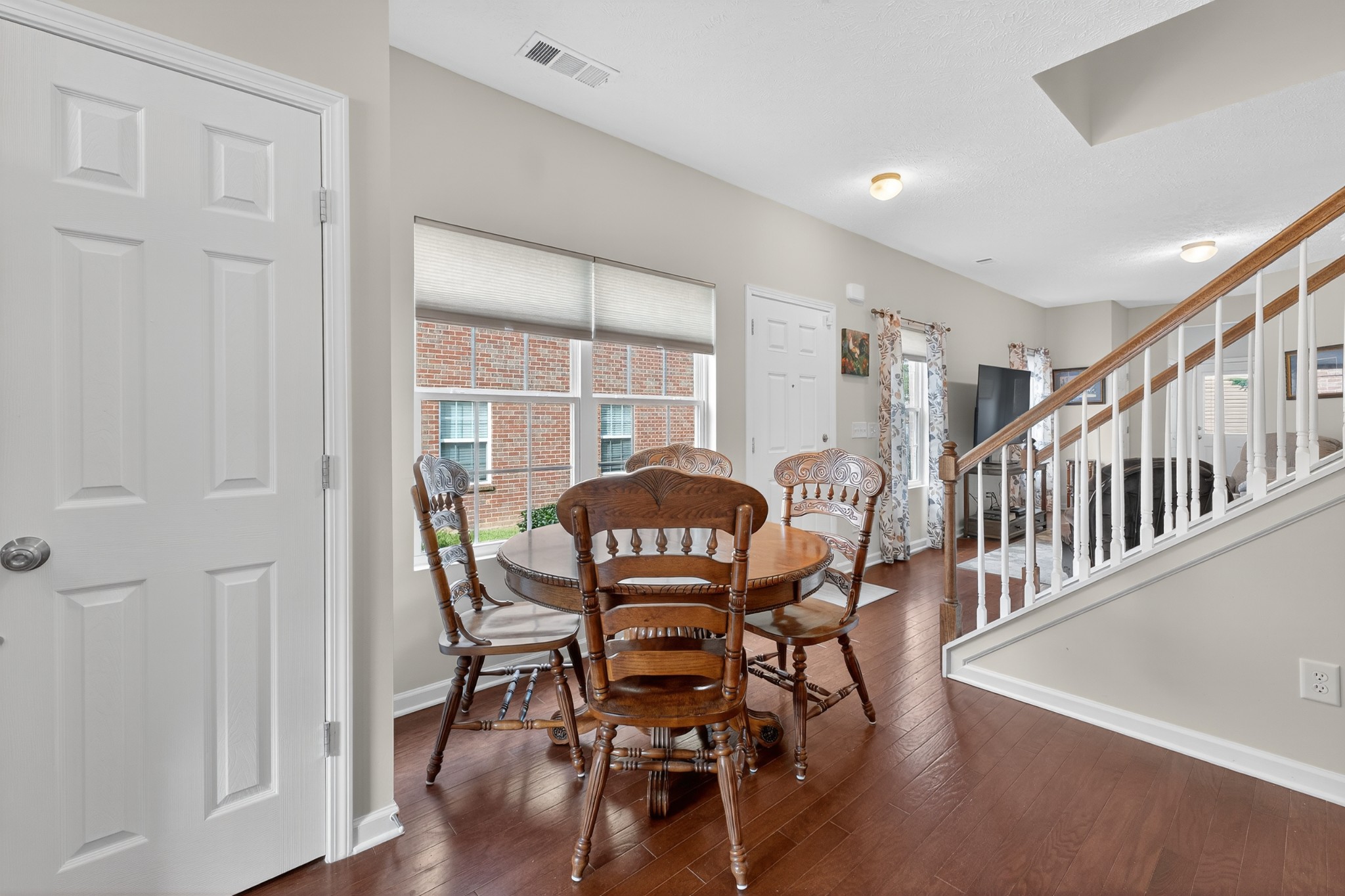 1309 Crown Point Place Nashville, TN 37211 - Photo 9 of 42 a view of a dining room with furniture and wooden floor