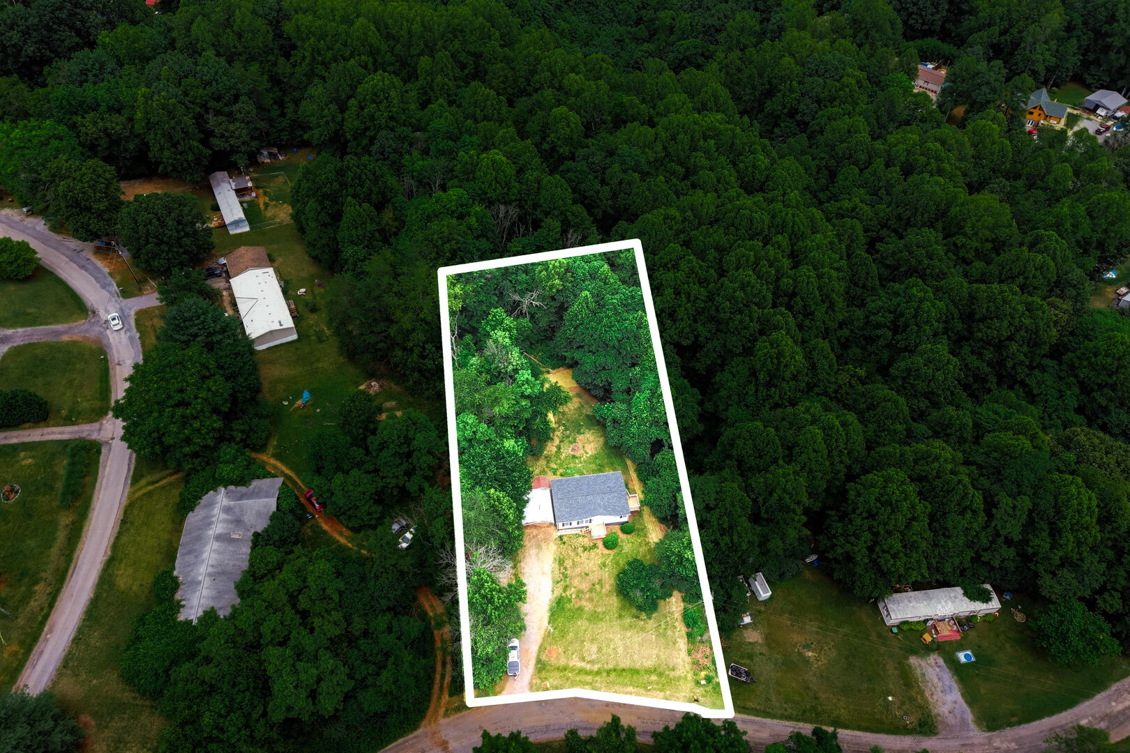 304 Ridgelake Road Goodview, VA 24095 - Photo 34 of 34 an aerial view of residential houses with outdoor space and trees