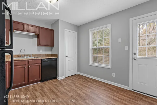 a kitchen with a refrigerator stove and sink