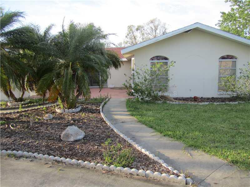 3810 Headsail Drive New Port Richey, FL 34652 - Photo 1 of 1 a backyard of a house with lots of green space