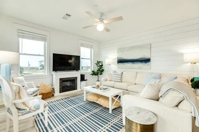 a bedroom with a bed and a table with wooden floor