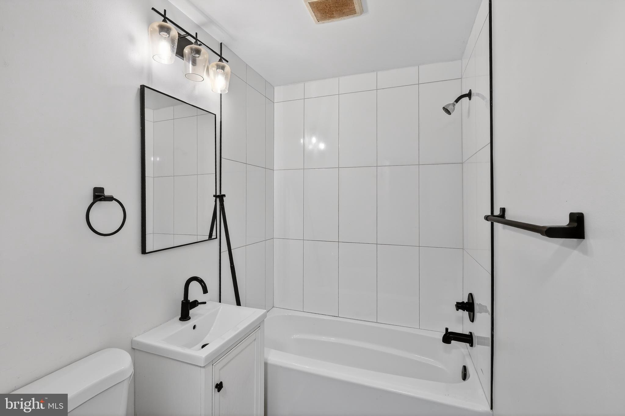 4570 MacArthur Boulevard Northwest, Unit 208 Washington, DC 20007 - Photo 15 of 17 a bathroom with a sink and a shower