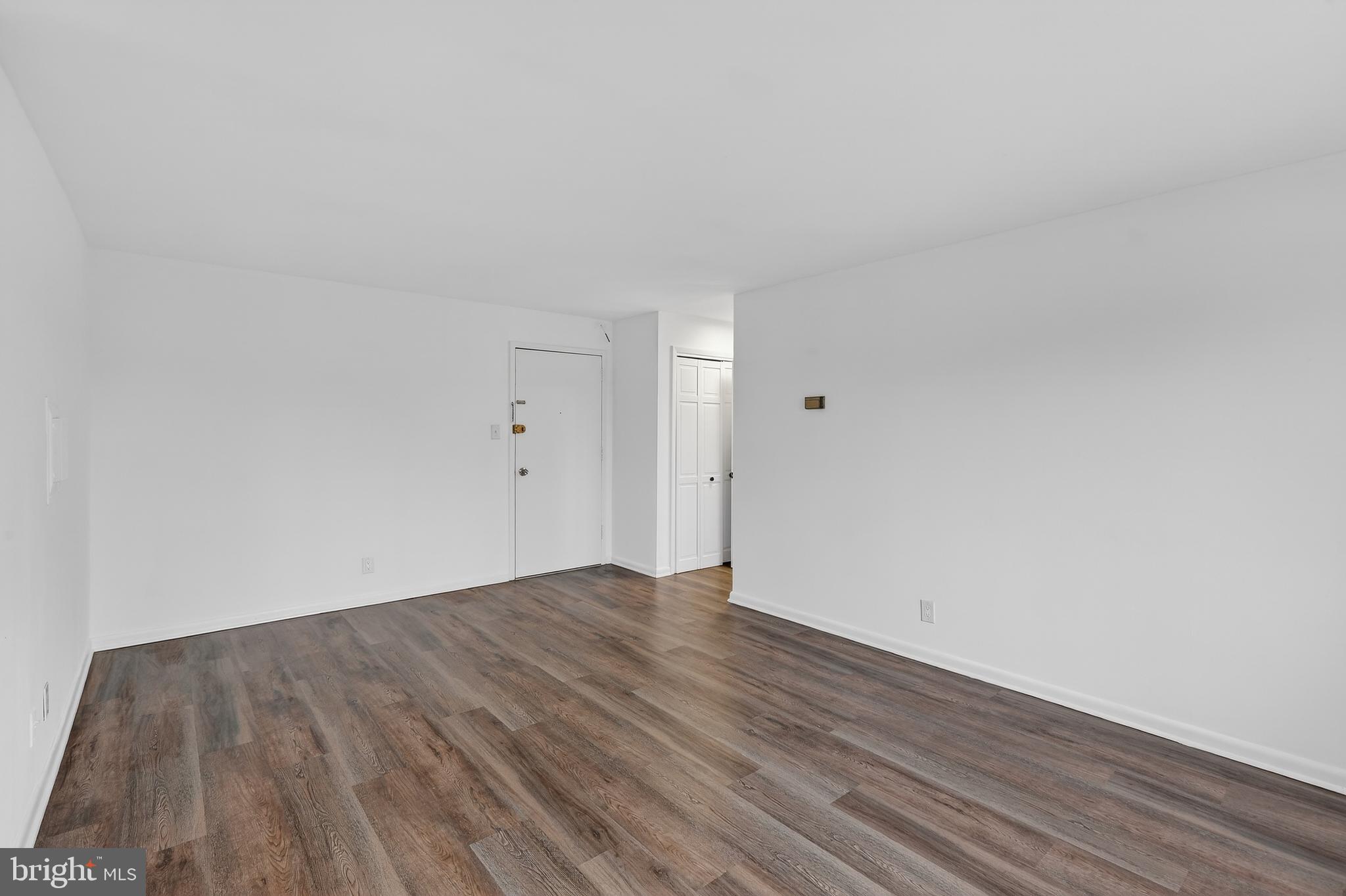 4570 MacArthur Boulevard Northwest, Unit 208 Washington, DC 20007 - Photo 10 of 17 a view of an empty room and wooden floor