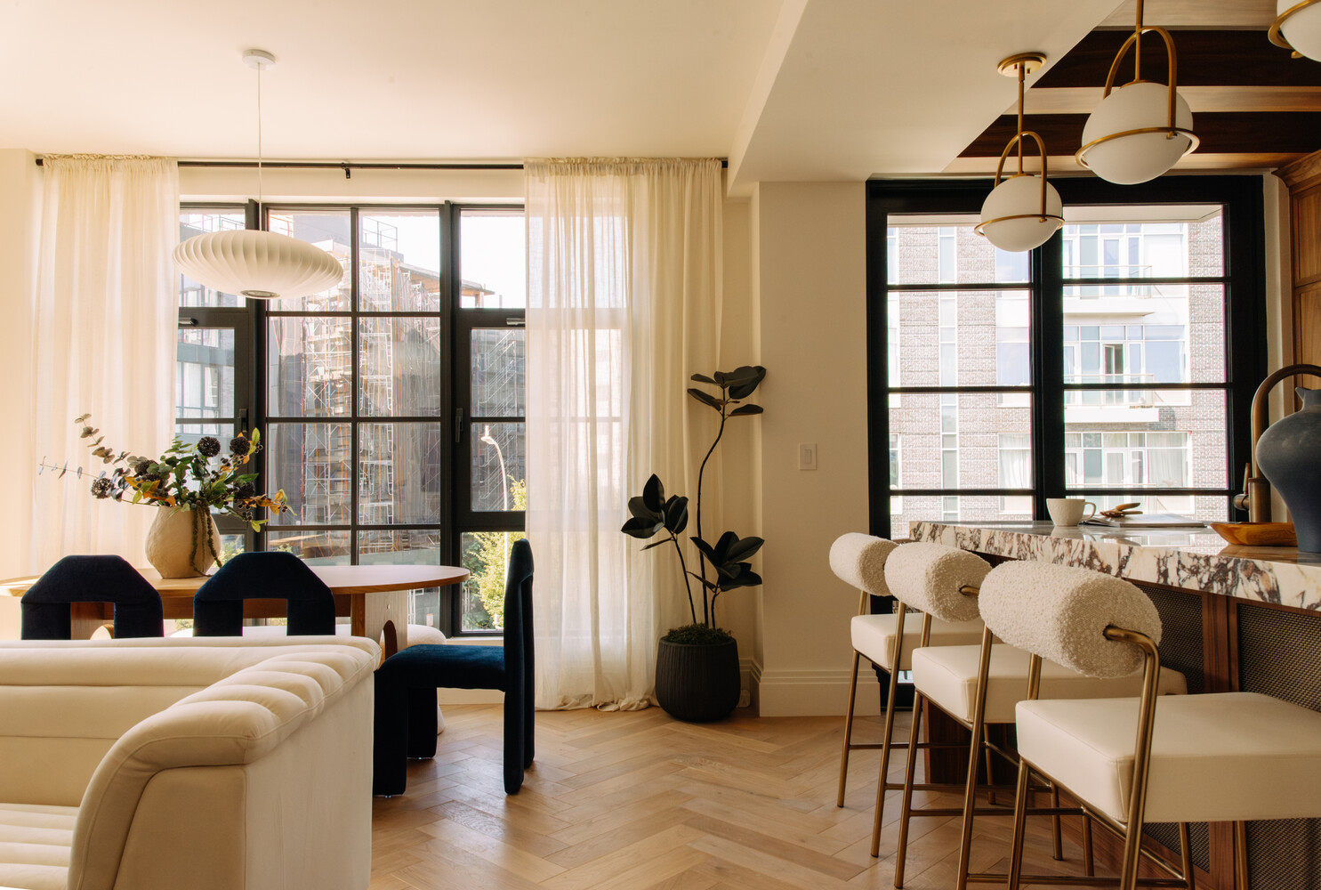 402 Union Avenue, Unit PH2 Brooklyn, NY 11211 - Photo 2 of 23 a living room with furniture a table and a large window