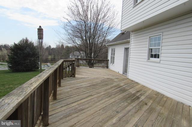 8401 Rocky Springs Road Frederick, MD 21702 - Photo 3 of 23 a balcony with wooden floor and outdoor space