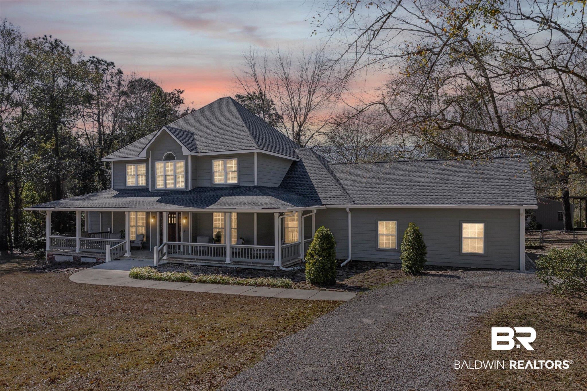 31369 Blakeley Way Daphne, AL 36527 - Photo 1 of 38 Country-style home with covered porch, a shingled roof, driveway, and a front yard