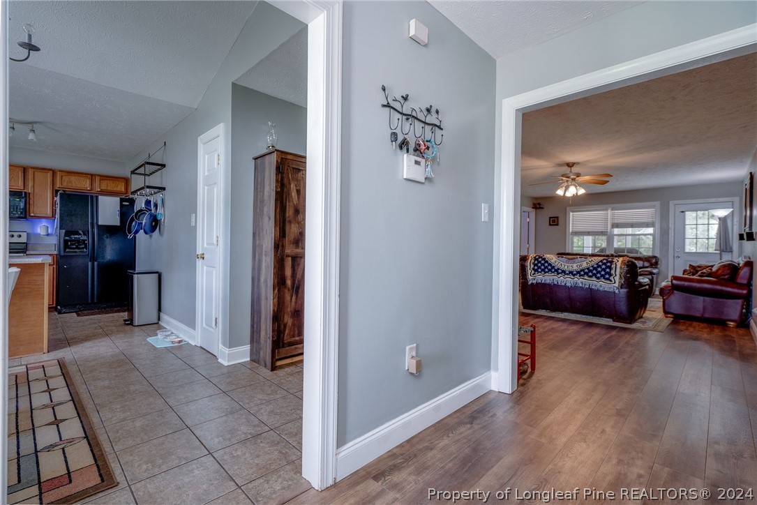 3590 Calloway Road Raeford, NC 28376 - Photo 12 of 44 a living room with furniture and a wooden floor