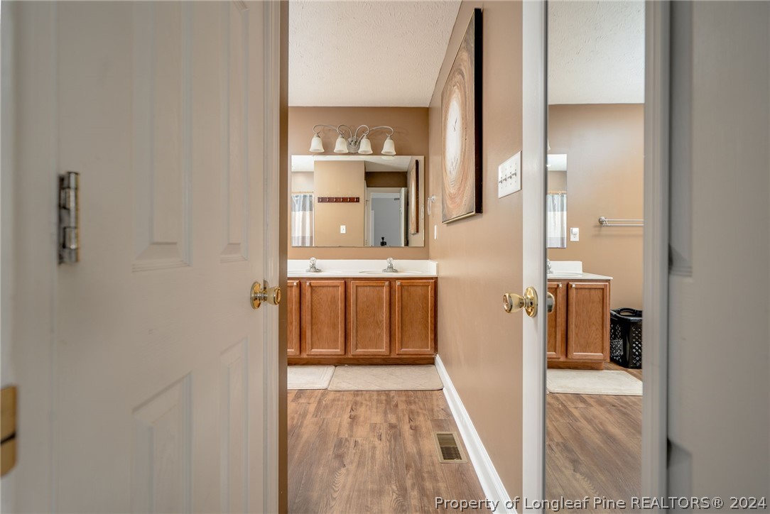 3590 Calloway Road Raeford, NC 28376 - Photo 16 of 44 a view of a bathroom from the hallway