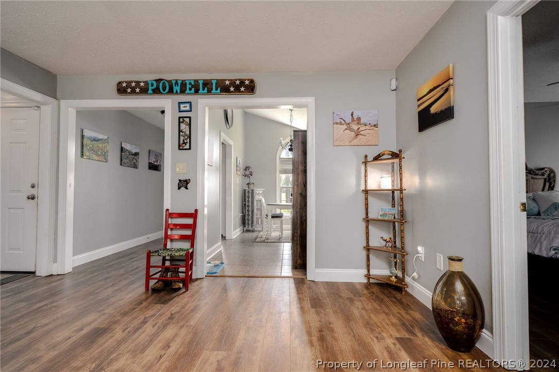 3590 Calloway Road Raeford, NC 28376 - Photo 24 of 44 a view of a livingroom with wooden floor and a flat screen tv