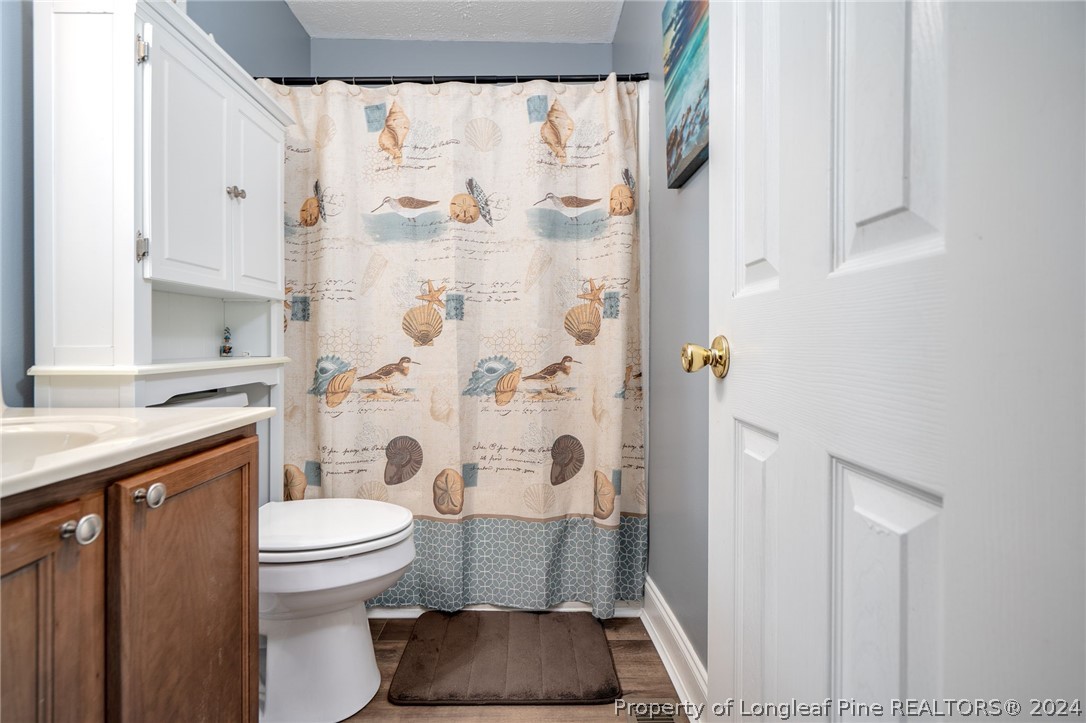 3590 Calloway Road Raeford, NC 28376 - Photo 28 of 44 a bathroom with a toilet and a shower