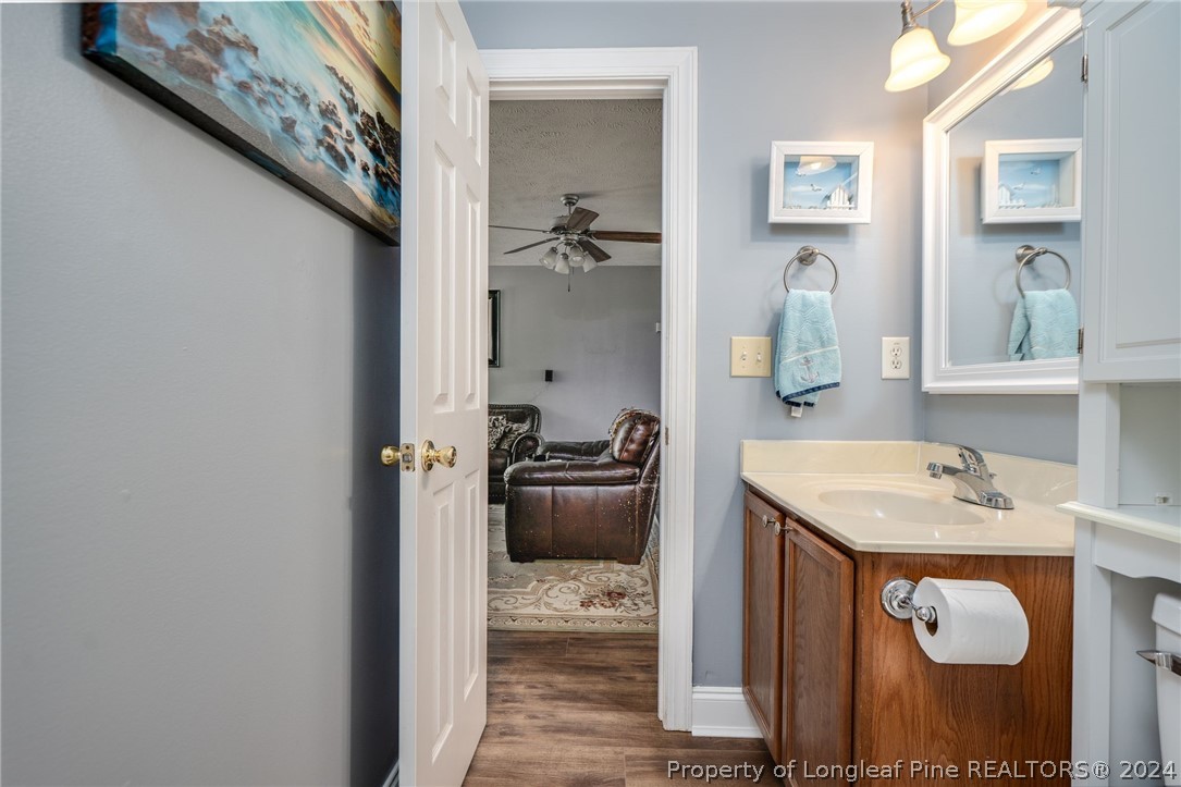 3590 Calloway Road Raeford, NC 28376 - Photo 29 of 44 a bathroom with a sink a toilet and shower