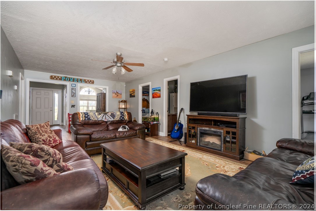 3590 Calloway Road Raeford, NC 28376 - Photo 33 of 44 a living room with furniture and a flat screen tv