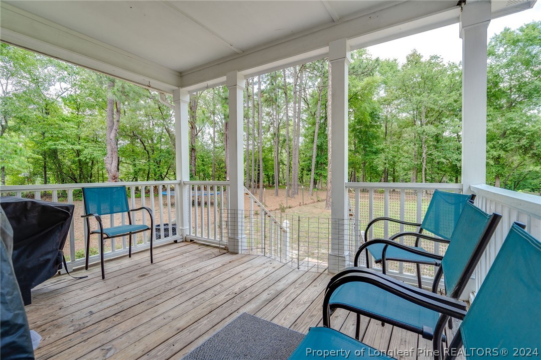 3590 Calloway Road Raeford, NC 28376 - Photo 40 of 44 a view of a chair and table on the deck