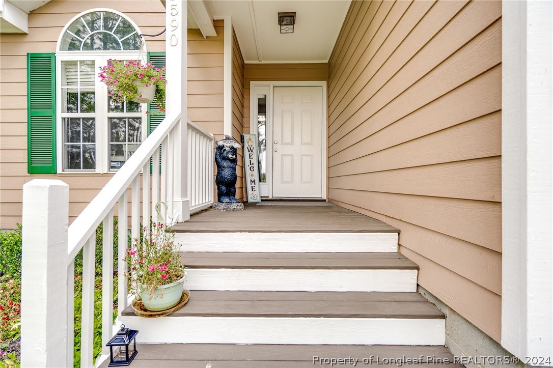 3590 Calloway Road Raeford, NC 28376 - Photo 5 of 44 a view of stairs with wooden floor and windows