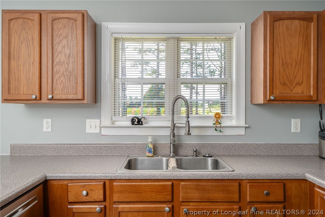 3590 Calloway Road Raeford, NC 28376 - Photo 9 of 44 a kitchen with stainless steel appliances granite countertop a sink and a window