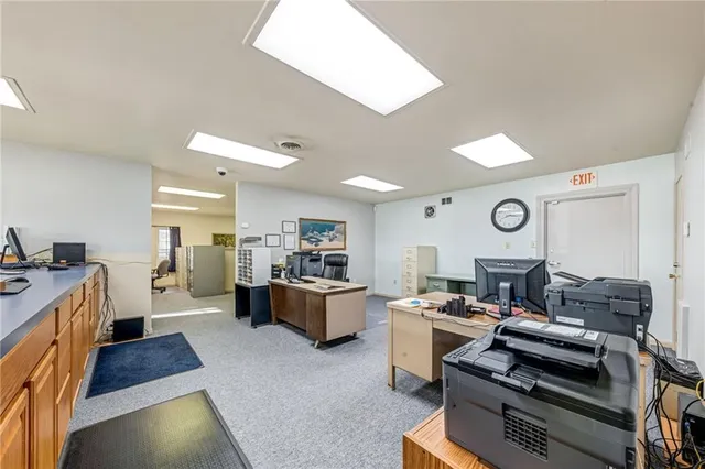 a large white kitchen with a large window