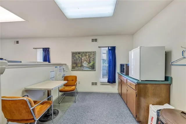a kitchen with a sink cabinets and window