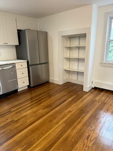 a view of kitchen and wooden floor