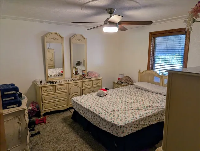 a bed room with a bed and a dresser