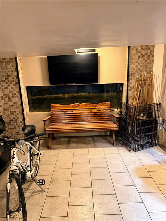 344 McKee Road North Versailles, PA 15137 - Photo 19 of 40 a room with gym equipment and a fireplace