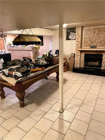 a living room with a fireplace and a table