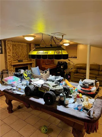 a room with lots of furniture and clutter