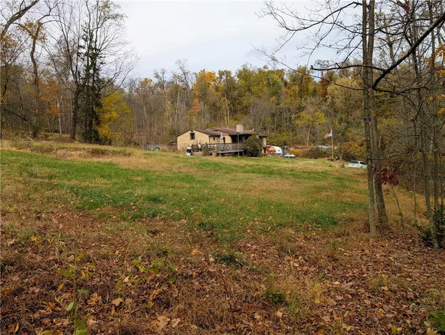 a view of outdoor space with trees all around