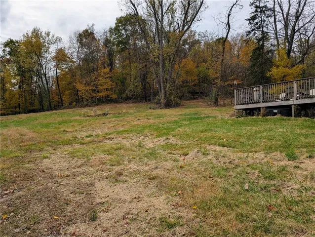 a view of outdoor space with trees all around