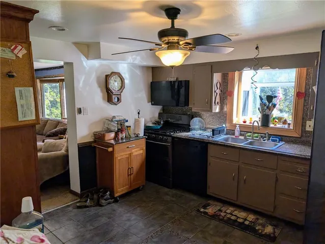 a kitchen with a counter space cabinets and appliances