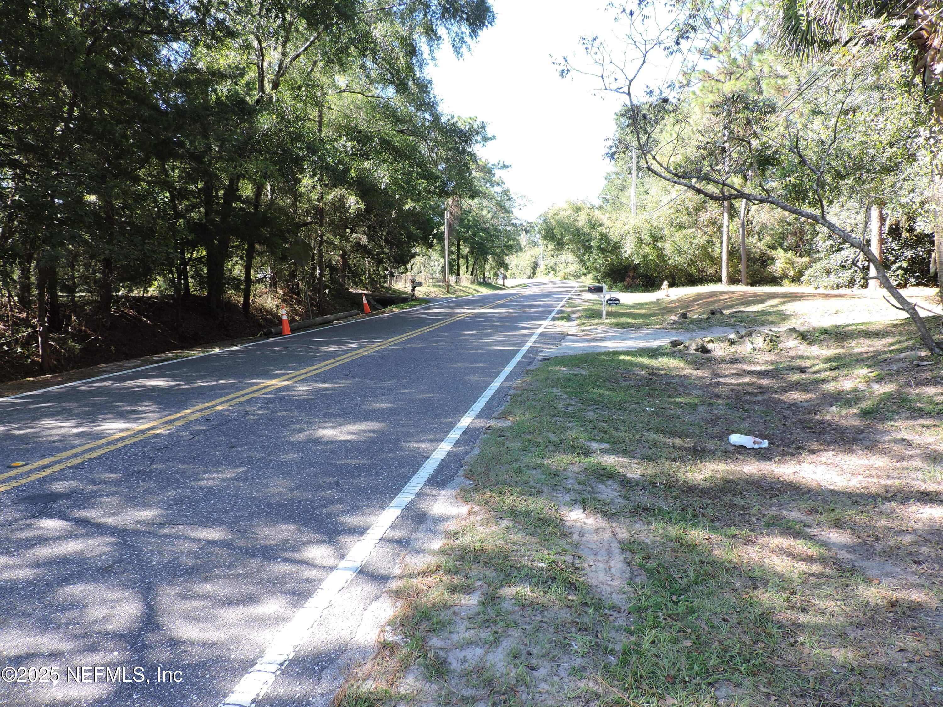 2955 New Berlin Road Jacksonville, FL 32226 - Photo 13 of 35 a view of road with yard and trees around