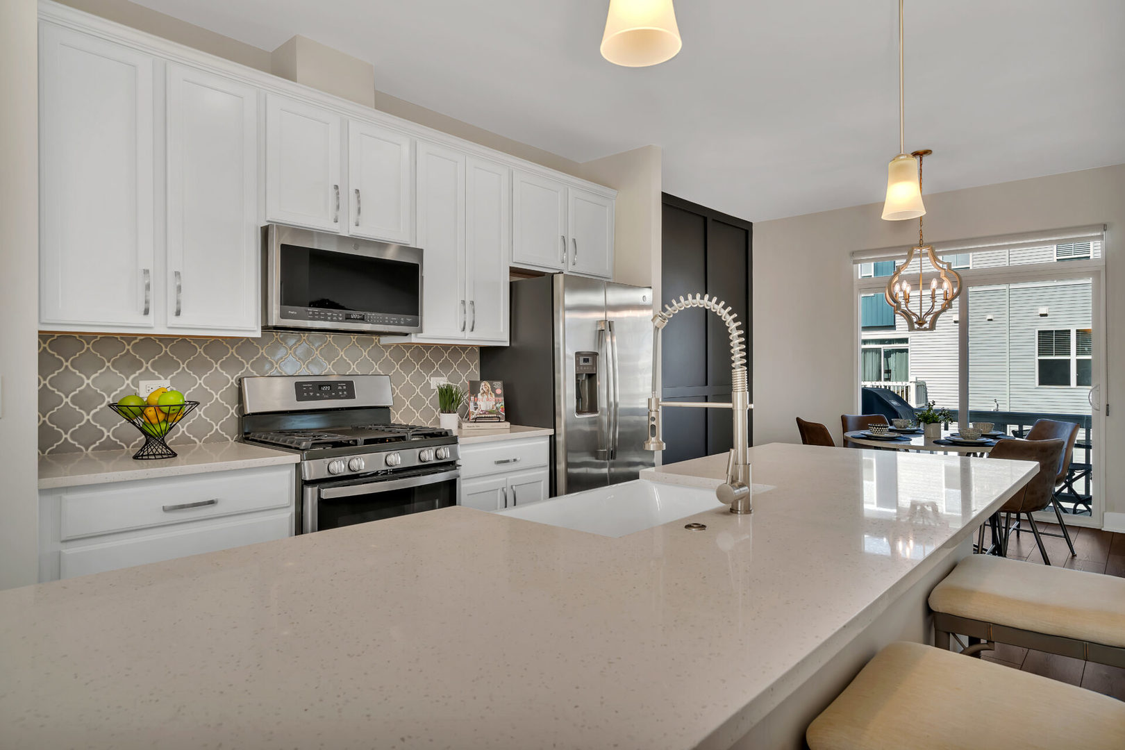 4133 Calder Lane Aurora, IL 60504 - Photo 11 of 31 a kitchen with stainless steel appliances a stove a sink a microwave a refrigerator a stove and white cabinets