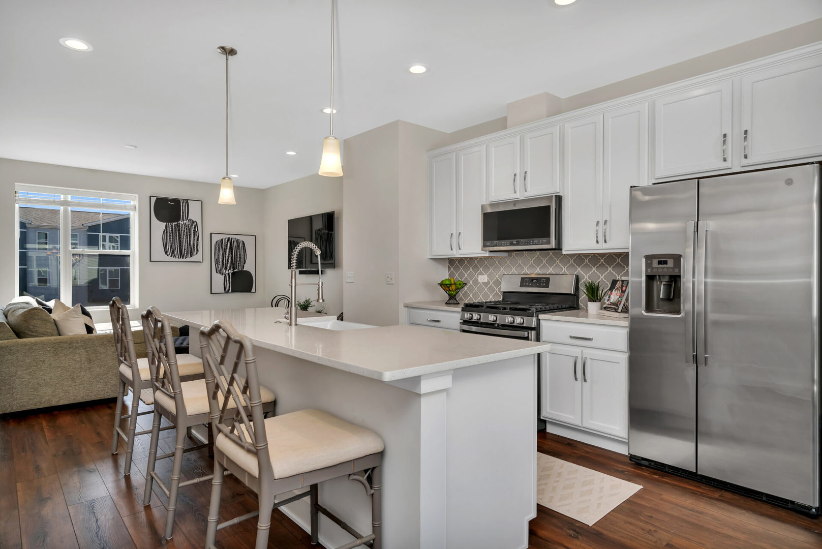 4133 Calder Lane Aurora, IL 60504 - Photo 13 of 31 a kitchen with stainless steel appliances granite countertop a refrigerator a stove a sink a dining table and chairs with wooden floor