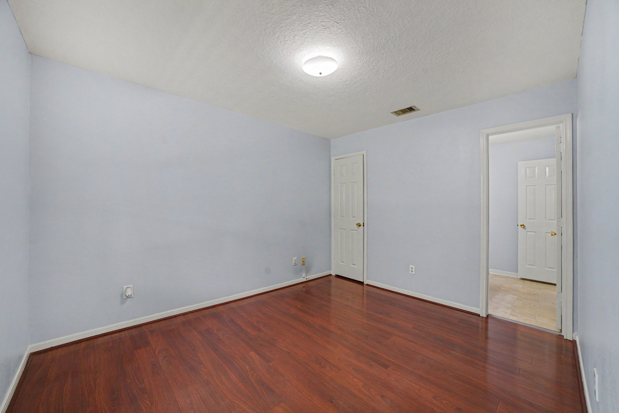 5622 Wasabi Lane Baytown, TX 77521 - Photo 11 of 29 a view of an empty room with wooden floor