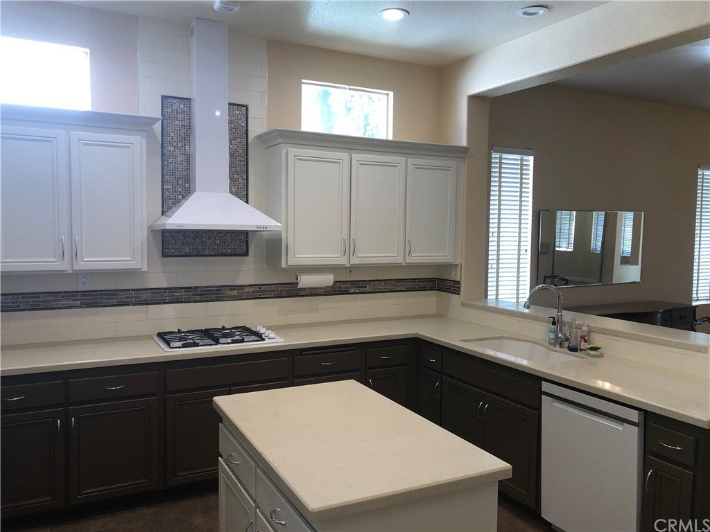 30888 Balata Drive Temecula, CA 92591 - Photo 9 of 44 a kitchen with a sink stove and cabinets