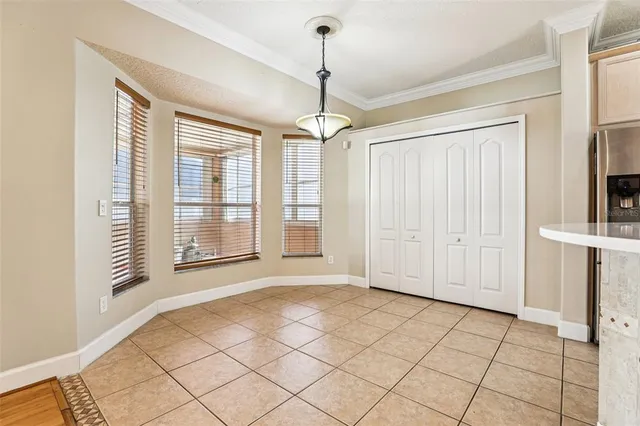 a view of a kitchen with a dishwasher cabinets and a floor to ceiling window