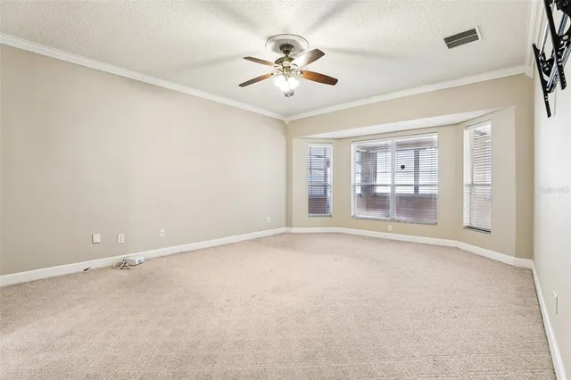 a spacious bathroom with a granite countertop sink a mirror and a shower