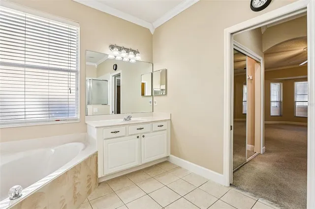 a bathroom with a sink double vanity and a mirror