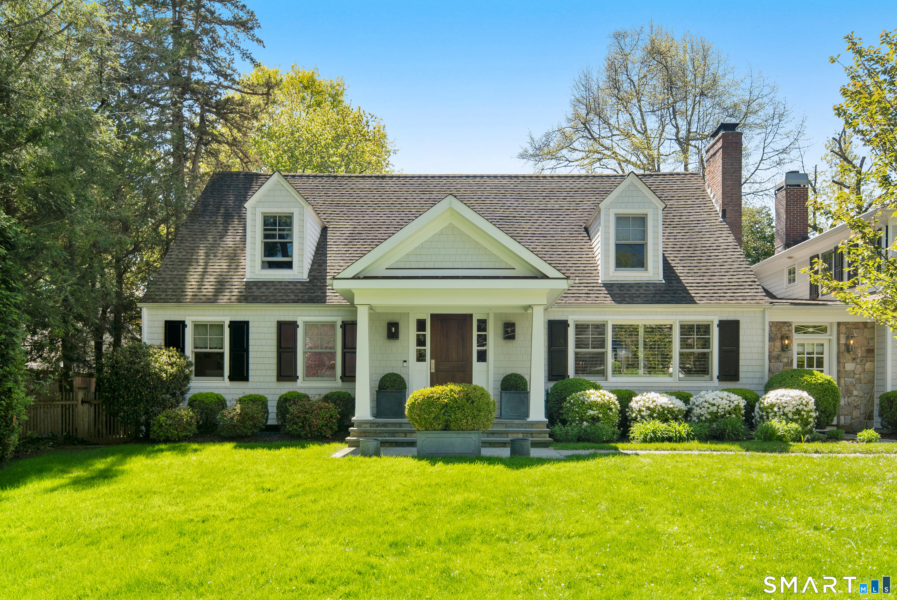 11 McLaren Road South Darien, CT 06820 - Photo 2 of 40 front view of a house with a yard