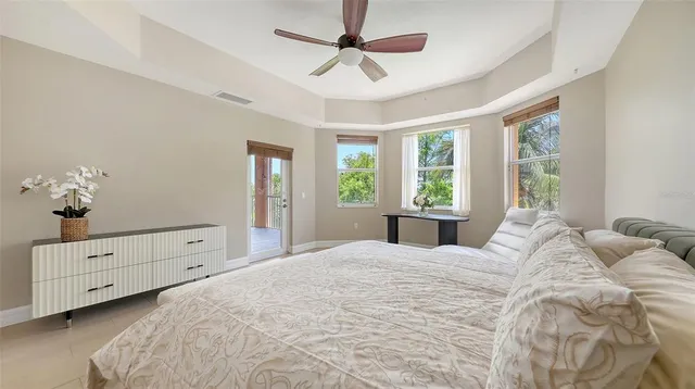 a bedroom with a bed and a window dresser