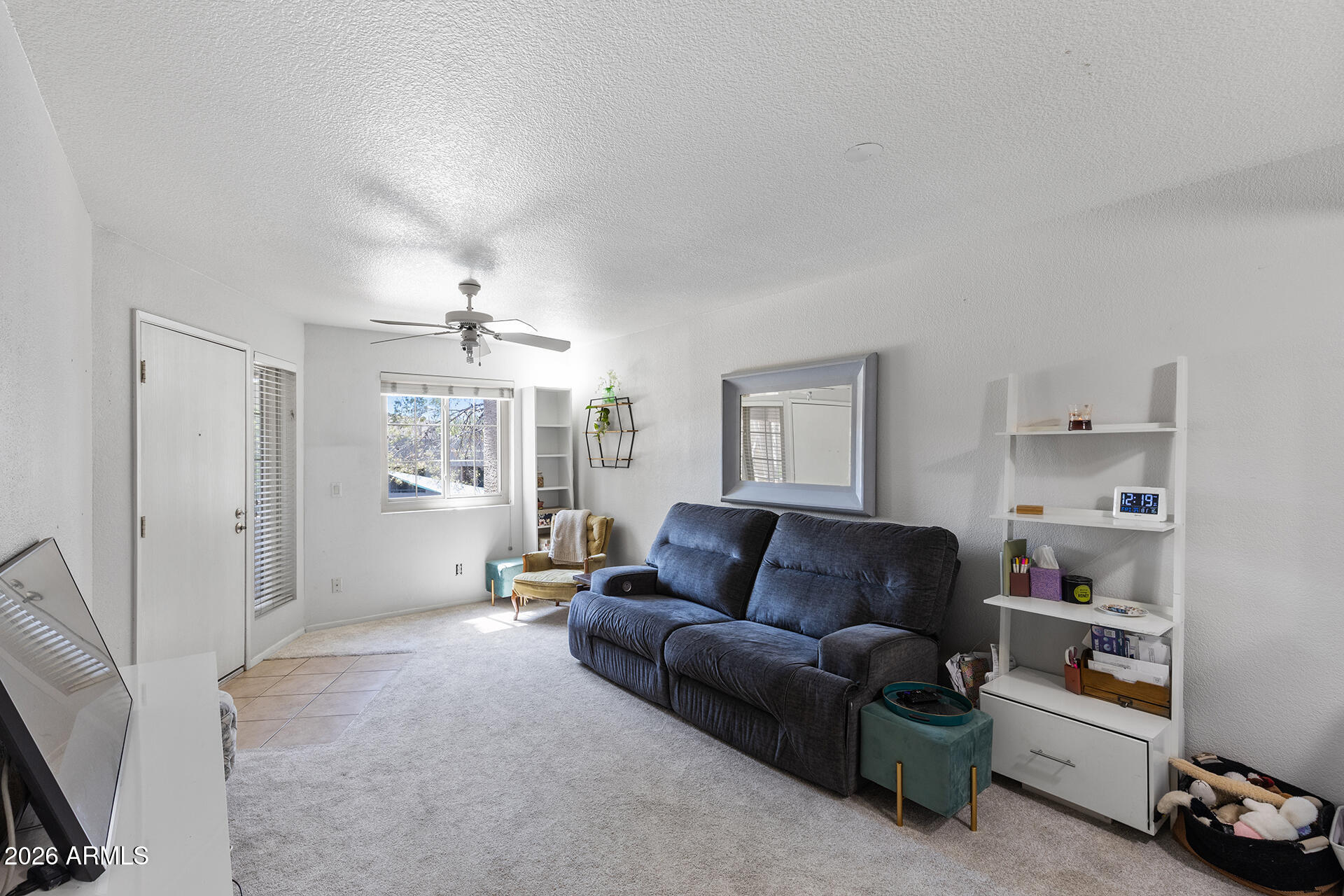 1720 East Thunderbird Road, Unit 2063 Phoenix, AZ 85022 - Photo 17 of 32 a living room with furniture and a chandelier