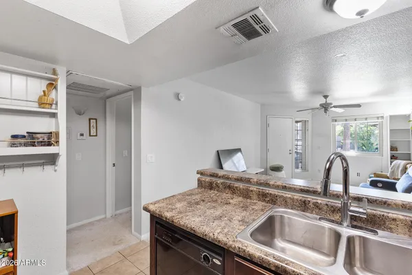 a kitchen with granite countertop stainless steel appliances and sink